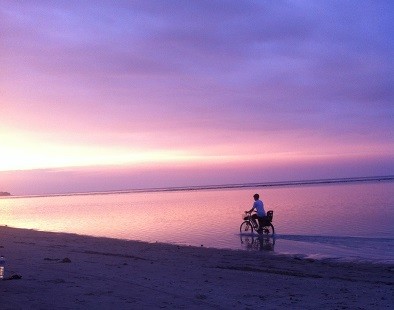 Cycling along the beach of Gili Air in Lombok, Indonesia