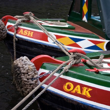 Traditional canal boats linked together 