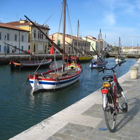 Colourful canal scene - discover this and more on our Really Rather Special cycling holiday in Italy