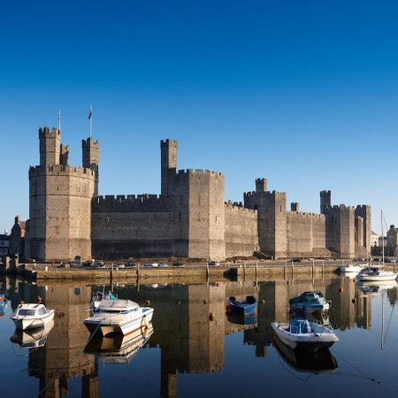 Caernarvon Castle one of the many gems to discover on this walking holiday in Wales