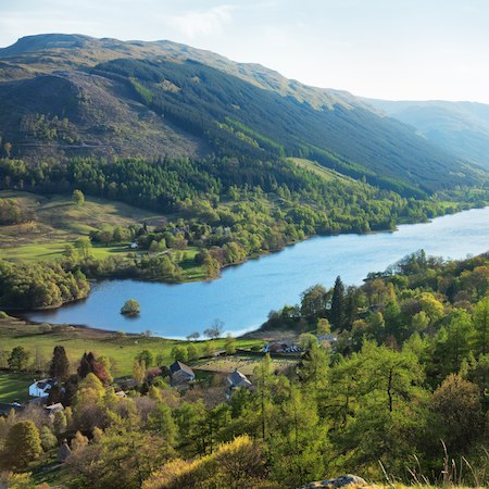 View from above of a Scottish loch which features on the route of our 'Lochs and glens to Edinburgh' cycling holiday.