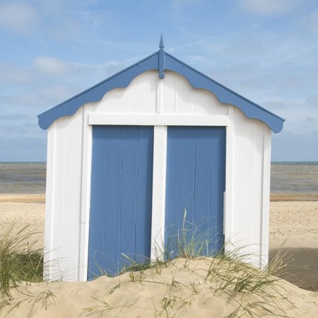 Bright coloured beach huts on the route of our Whistle-stop Devon biking holiday