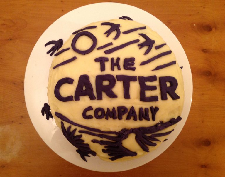 The Carter Company logo on a home-made cake