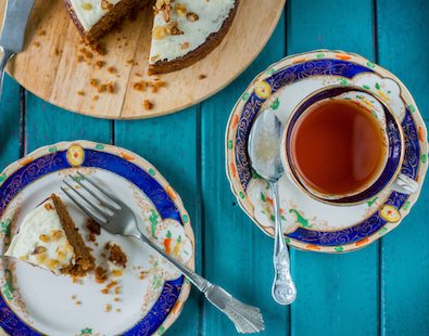 Tea and cake served on a table - our favourite thing about cycling and walking holiday pit stops