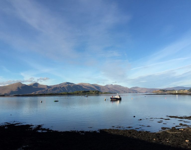 Image looking out to the loch from Port Appin in Scotland in the late afternoon. Visit Port Appin on our Scottish self-guided luxury cycling holidays